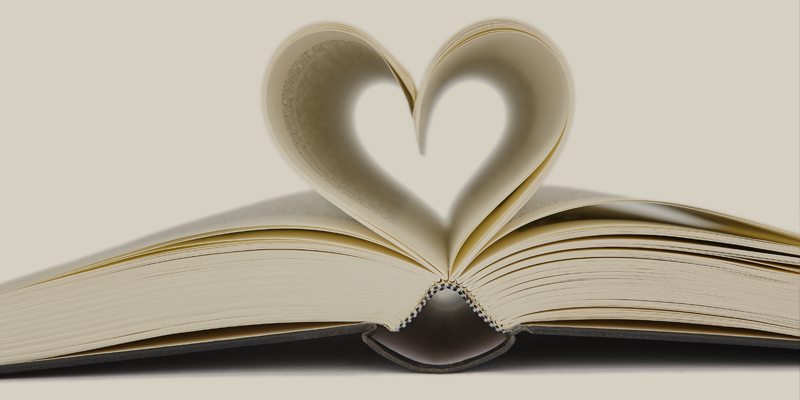 open book with heart shape made by pages illustrating 'the heart of the text'